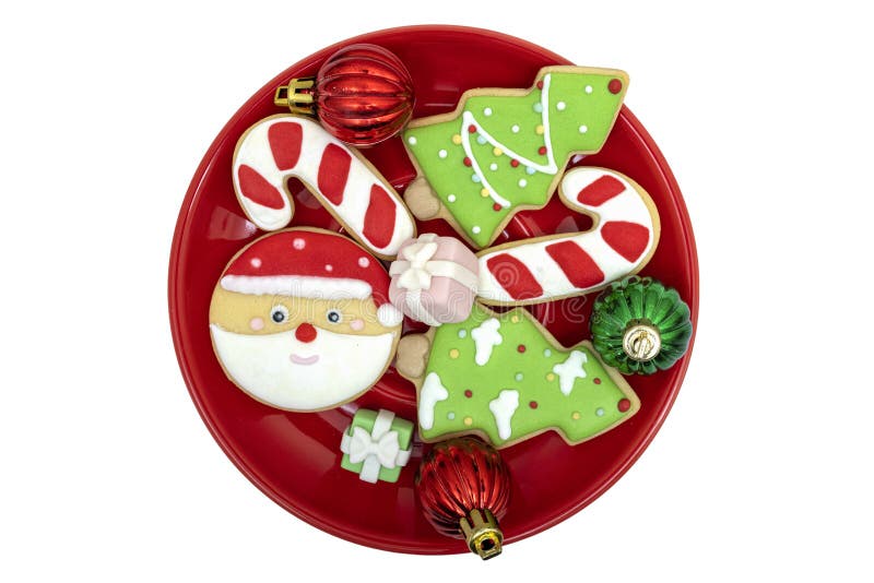 Sugar Coated Cookies on a Bright Red Plate with Christmas Decorations