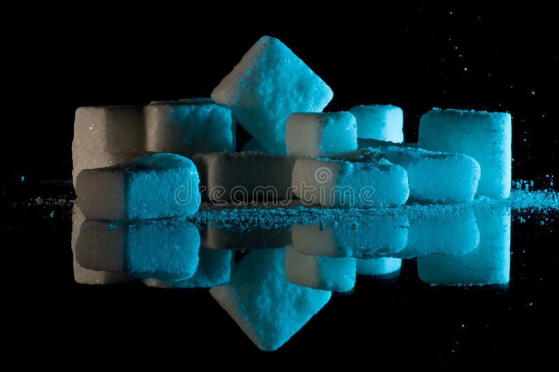 Sugar cubes on glass stock images Sugar cubes on glass stock images
