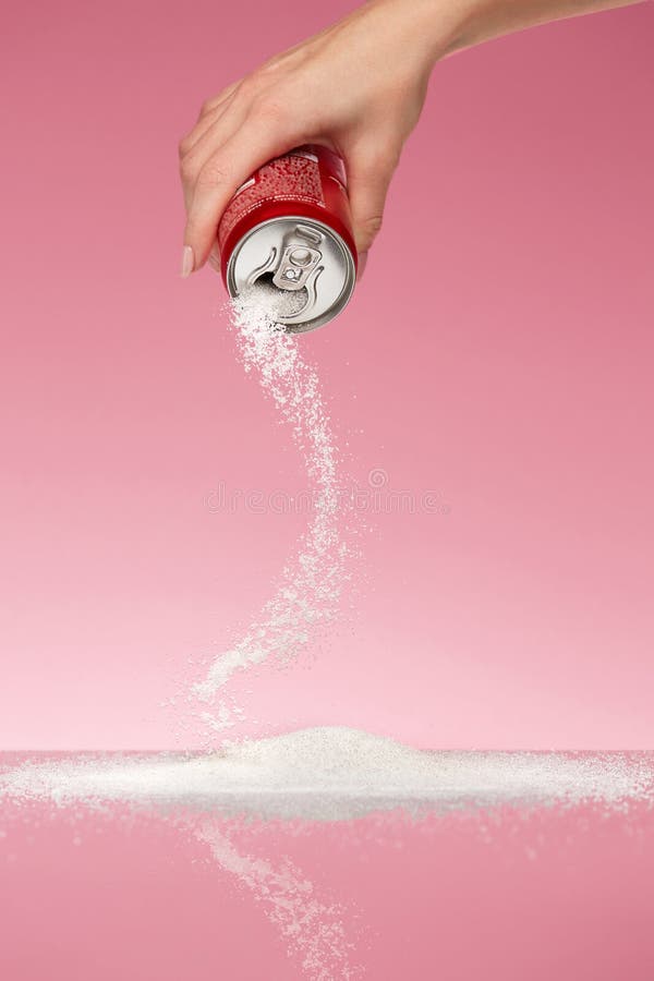 Sugar In Drinks. Hand Holding Soda Can With Sugar. Close Up Of White Sugar Pouring Out Sugar Of Beverage Can. Unhealthy Food Concept. High Quality Image
