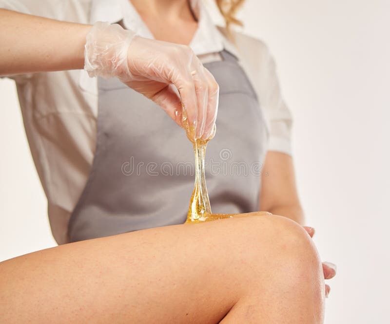 Sugar paste for light depilation. Depilation with sugar paste in the salon on a white background. Depilation paste stock images, royalty-free photos and pictures