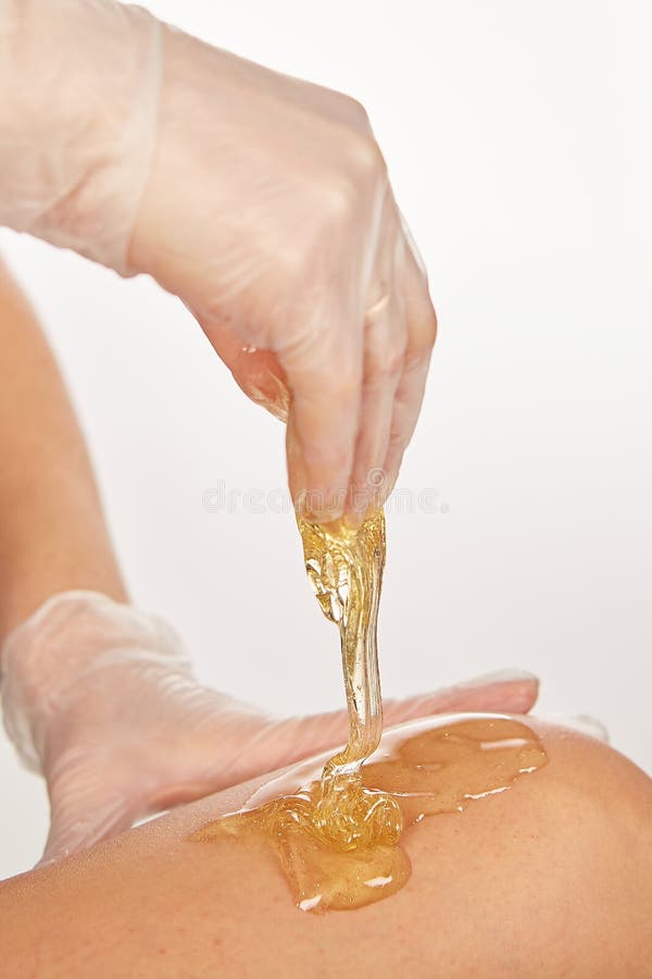 Sugar paste for light depilation. Depilation with sugar paste in the salon on a white background. Depilation paste stock images, royalty-free photos and pictures