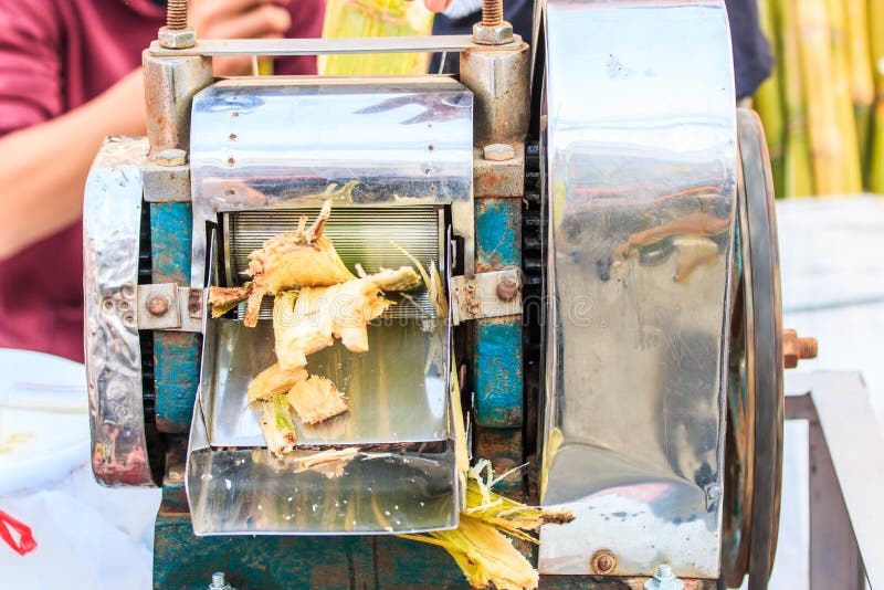 Sugarcane juice extraction stock image. Image of nature 37571281