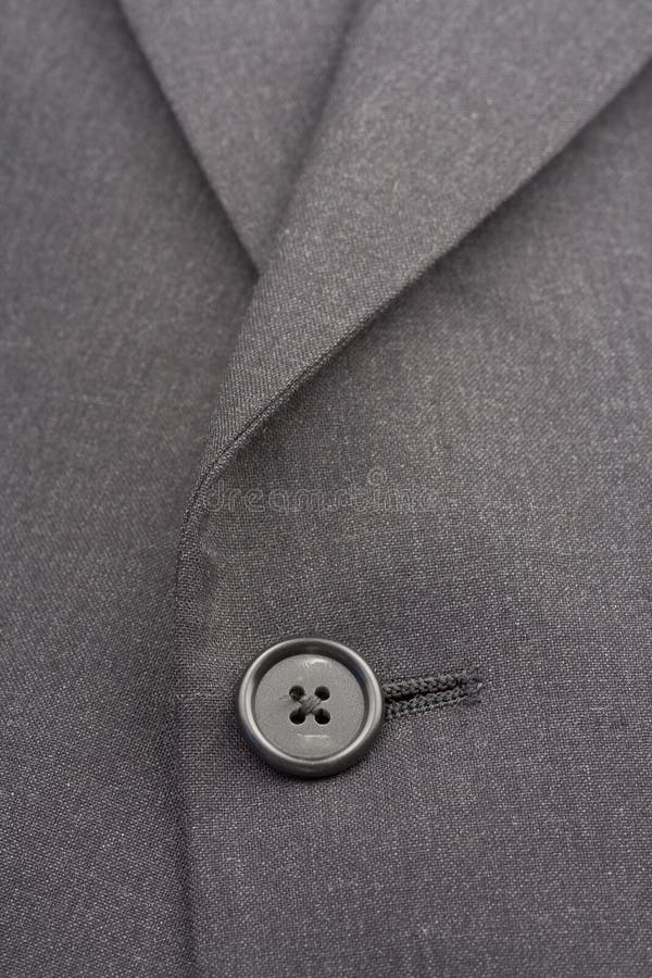 Up close of suit coat button and lines. Up close of suit coat button and lines.