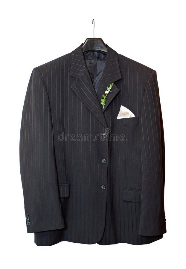 Suit jacket hanging on a hanger with a boutonniere in place on white background