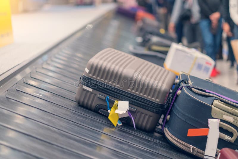 Suitcase or Luggage with Conveyor Belt in the Airport Stock Image
