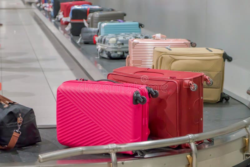 Suitcase or Luggage with Conveyor Belt in the Airport Stock Image