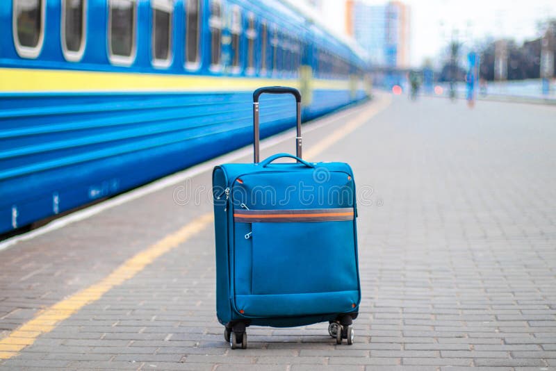 Suitcase on the Platform Next To the Train Station. Empty Platform