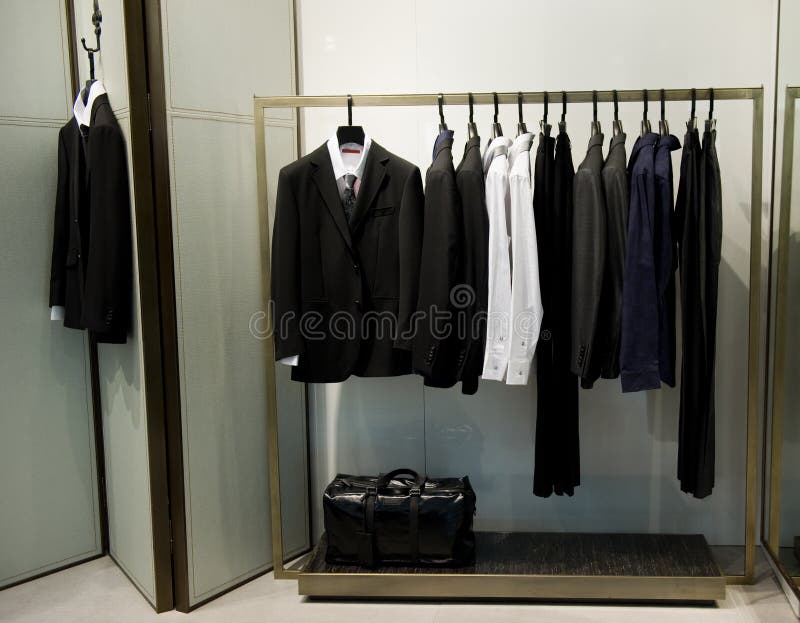 Display of Man Suits in a Closet Stock Photo - Image of closet, male ...