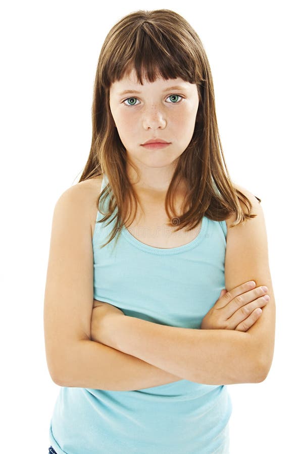 Sulky angry young girl child, sulking and pouting. Isolated on white background