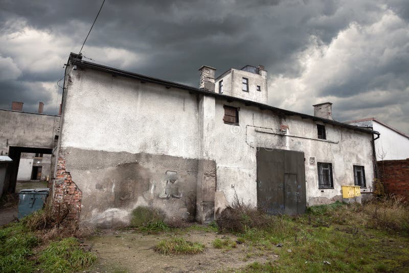 Sullen abandoned warehouse with stormy sky royalty free stock photos Sullen abandoned warehouse with stormy sky royalty free stock photos