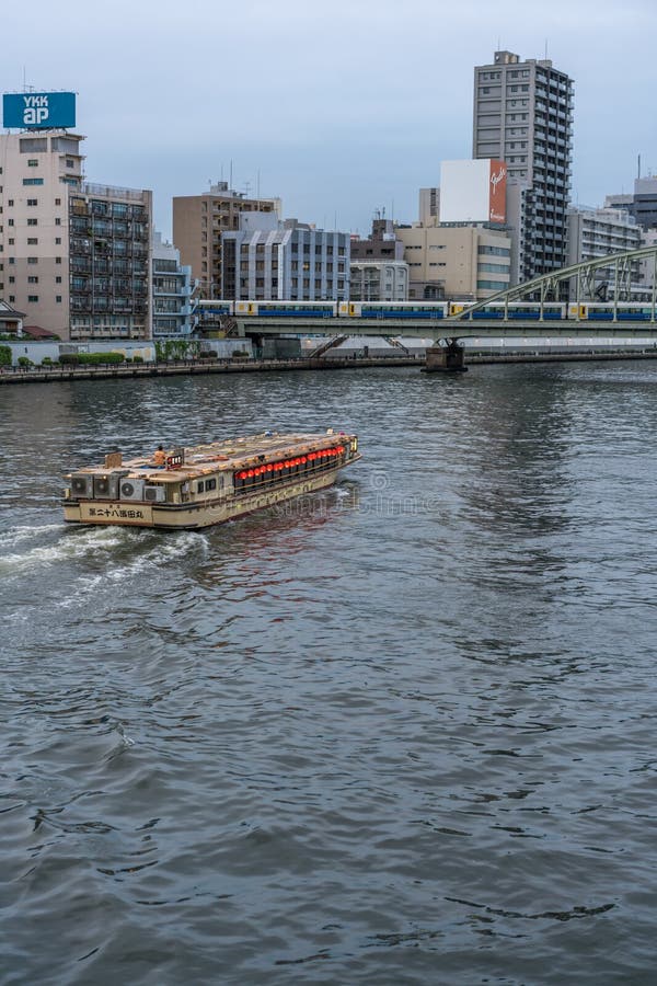 Sumida-ku, Tokyo - July 28, 2017: A boat in Sumida river and Yanagi-bashi bridge from Ryogoku-bashi Bridge