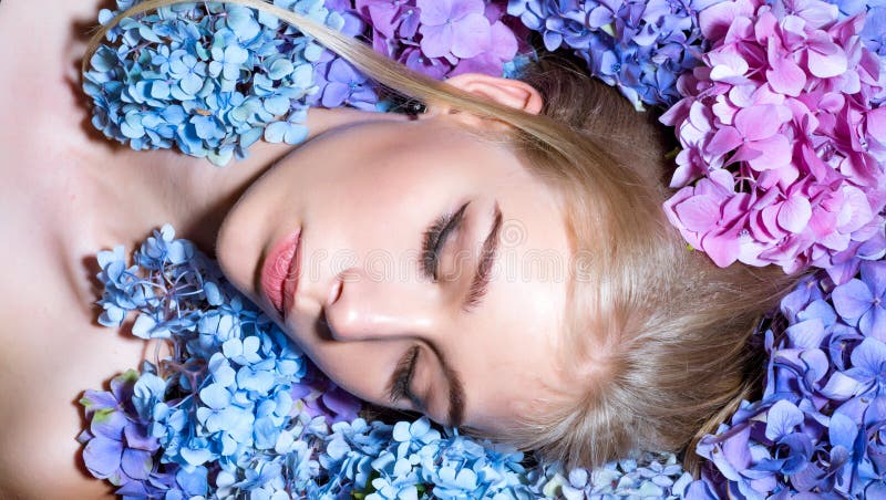 Summer beauty. girl with summer makeup. Makeup cosmetics and skincare. Spring woman with hydrangea flowers. Fashion royalty free stock photography Summer beauty. girl with summer makeup. Makeup cosmetics and skincare. Spring woman with hydrangea flowers. Fashion royalty free stock photography