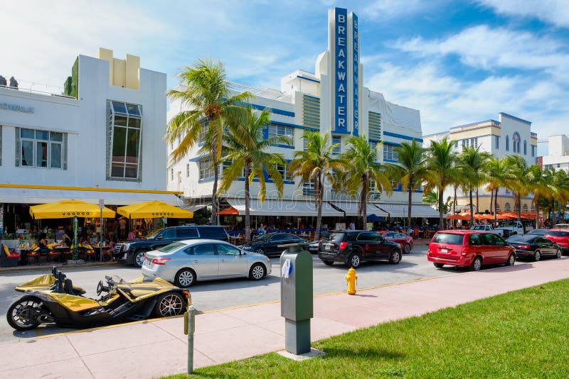 MIAMI BEACH, USA - AUGUST 27, 2016 : Colorful summer day at Ocean Drive, a popular tourist destination and home of several famous hotels, restaurants and discos in South Beach. MIAMI BEACH, USA - AUGUST 27, 2016 : Colorful summer day at Ocean Drive, a popular tourist destination and home of several famous hotels, restaurants and discos in South Beach