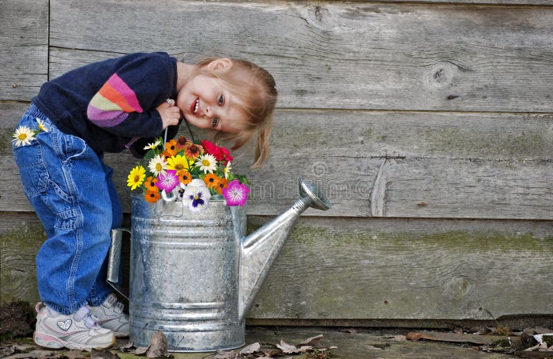 little girl with watering can