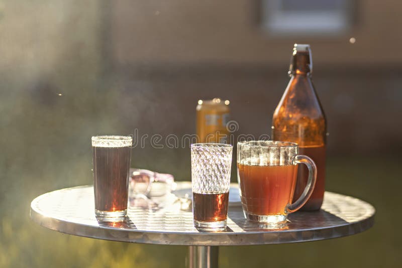 Summer Evening. Colored Drinks in Various Glassware on the Outdoor