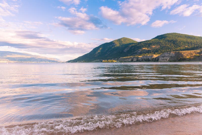 Summer evening view from sandy beach, of Okanagan Lake at Sun Oka Provincial Park