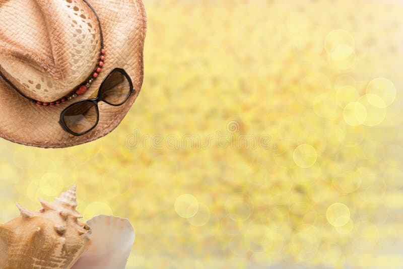 Summer fashion, straw hat, sun glasses and sea shell on illustrated yellow sandy beach. Travel and vacations concept. Holiday sea stock photos Summer fashion, straw hat, sun glasses and sea shell on illustrated yellow sandy beach. Travel and vacations concept. Holiday sea stock photos