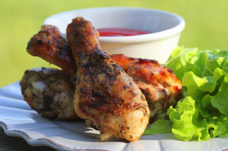 Summer food. Ideas for barbecue, grill party. Chicken legs with bbq sauce grilled, fried on fire