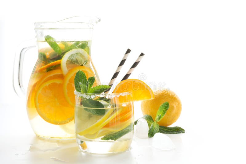 Summer fruits lemonade with ice and mint on white. Close up. royalty free stock photography Summer fruits lemonade with ice and mint on white. Close up. royalty free stock photography