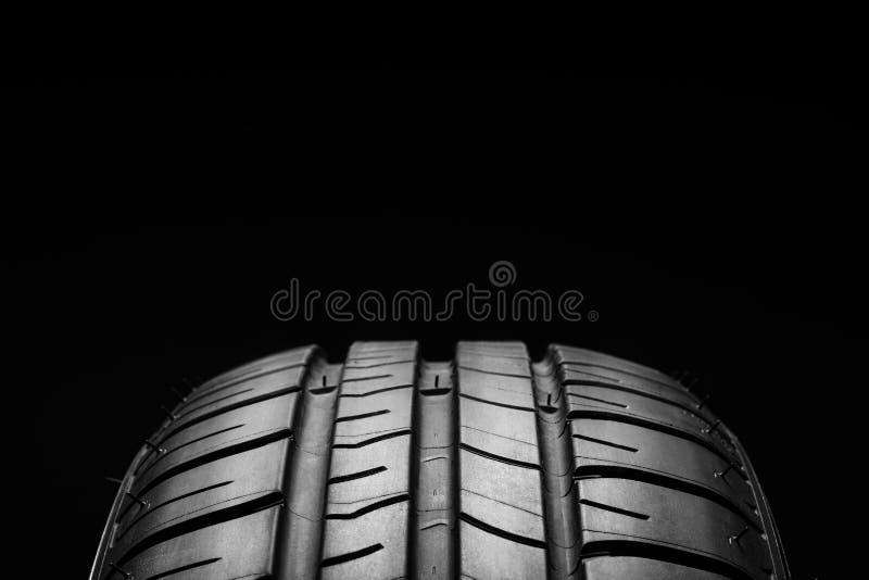 Summer fuel efficient car tires on black background