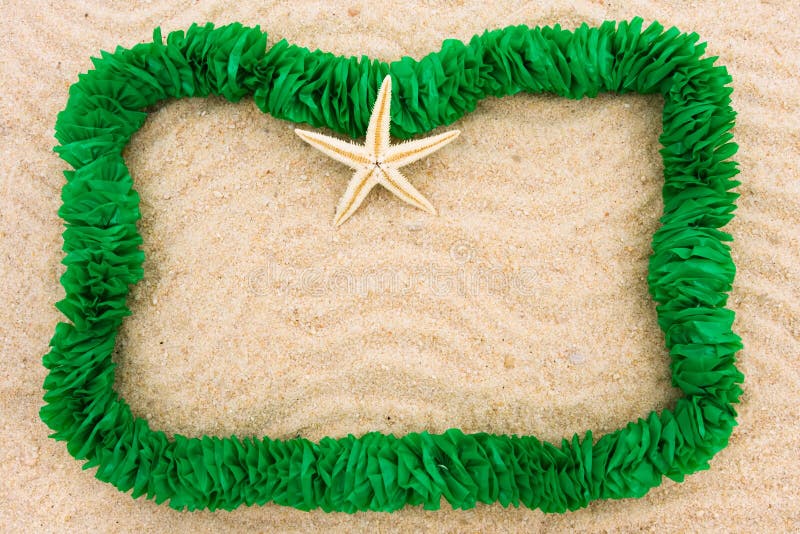 A green lei making a border on a sand background, Summer fun holiday border