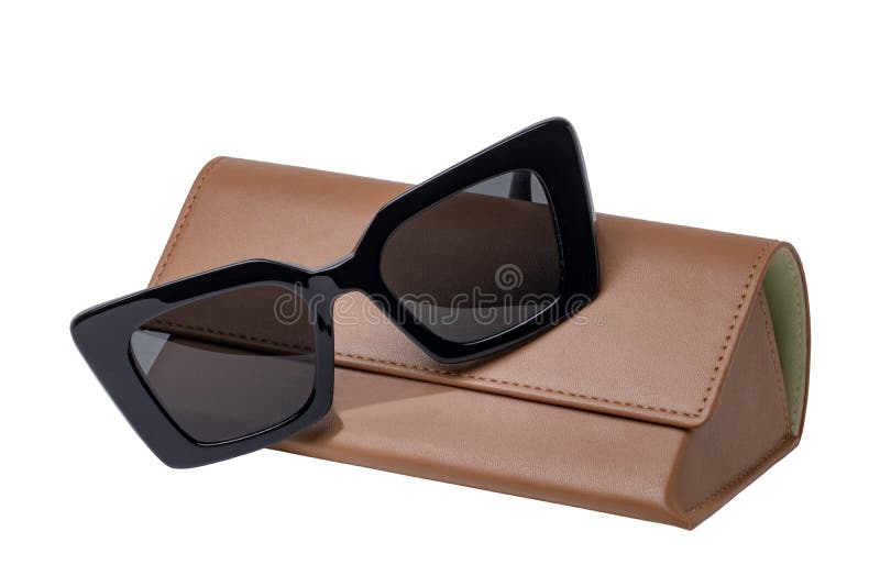 Summer glasses fashion. Female elegant trendy luxury black sun glasses resting on a brown leather case isolated on a white