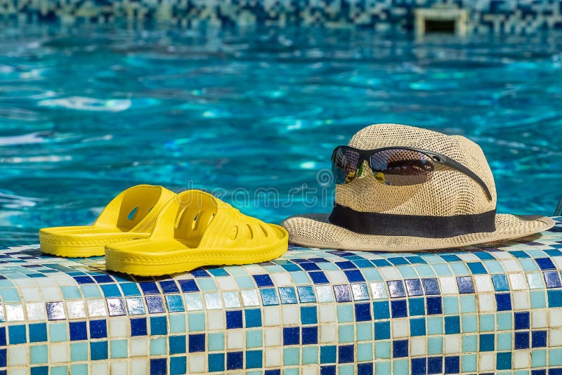 Summer Hat, Sunglasses and Yellow Flip-flops by the Pool at the Stock ...