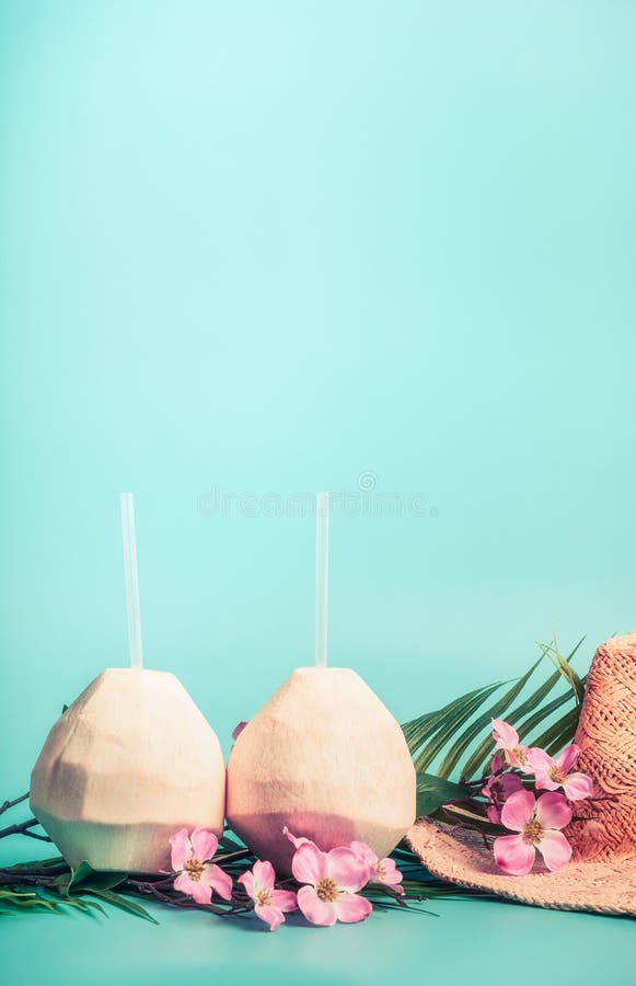 Summer holiday background with coconut drinks, straw hat, sunglasses. palm leaves and exotic flowers , front view. royalty free stock photography Summer holiday background with coconut drinks, straw hat, sunglasses. palm leaves and exotic flowers , front view. royalty free stock photography