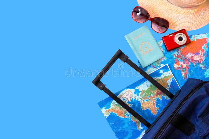 Summer holidays concept.  Travel, tourism and vacation concept background. Traveler accessories. Flat lay. Blue suitcase with trav