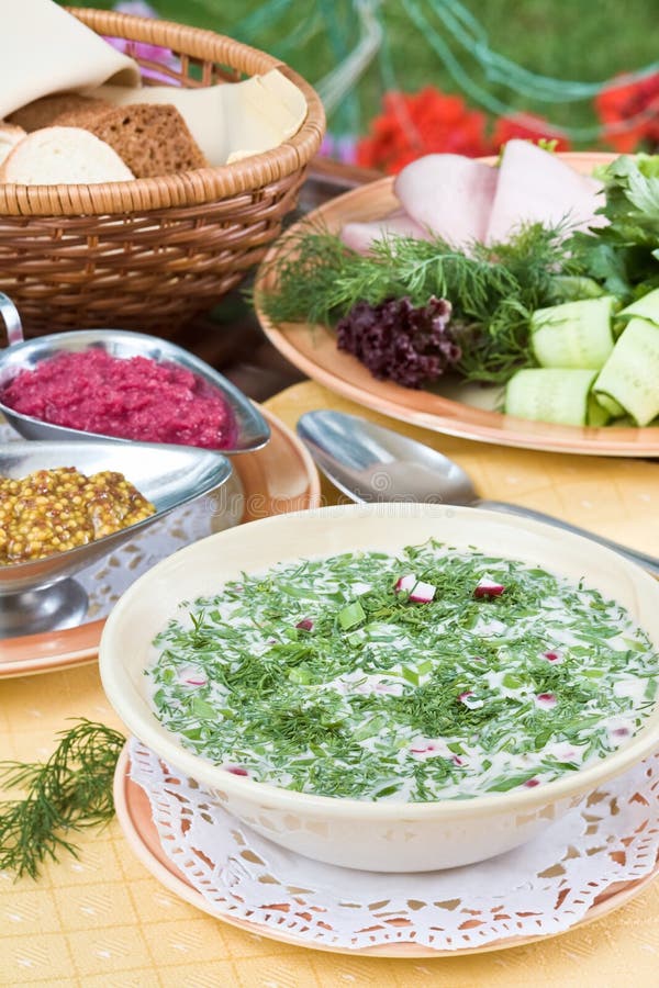 Summer kvass soup (okroshka) on served table