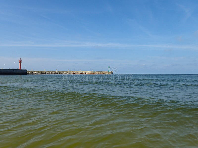 Summer landscape above the Baltic Sea on a warm sunny day with blue skies and people resting in the background stock images Summer landscape above the Baltic Sea on a warm sunny day with blue skies and people resting in the background stock images