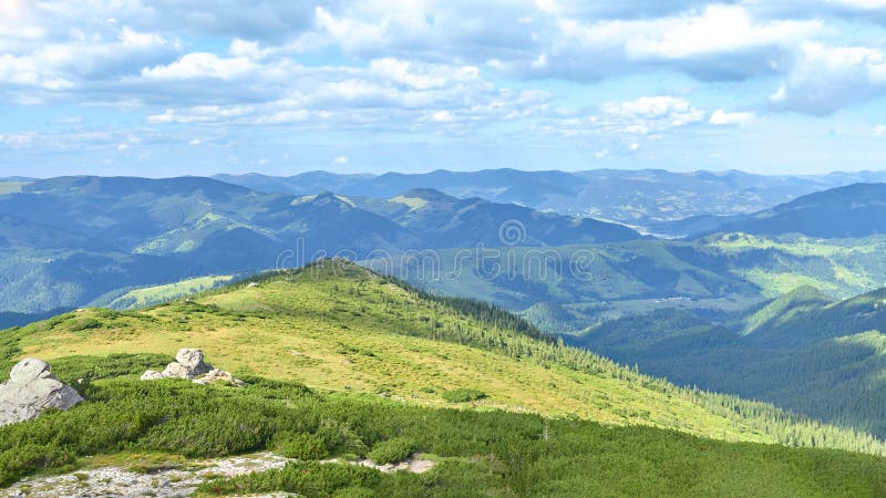 Summer landscape from the top of the mountain, overlooking the green mountain range and pines. 16:9. Summer landscape from the top of the mountain, overlooking royalty free stock photos Summer landscape from the top of the mountain, overlooking the green mountain range and pines. 16:9. Summer landscape from the top of the mountain, overlooking royalty free stock photos