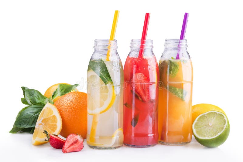 Summer lemonade bottles with lemon, strawberry and orange fruit.