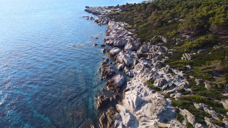 Summer morning and rocky sea coast in Greece. Aerial view