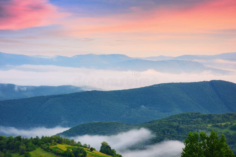 Summer mountains on a cloudy sunrise