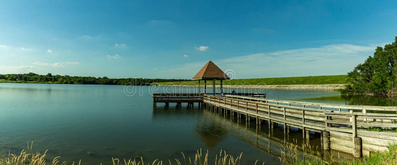 Summer in Omaha, Panorama Pier or gazebo with Reflection on the lake  Ed Zorinsky lake park, Omaha, Nebraska, USA