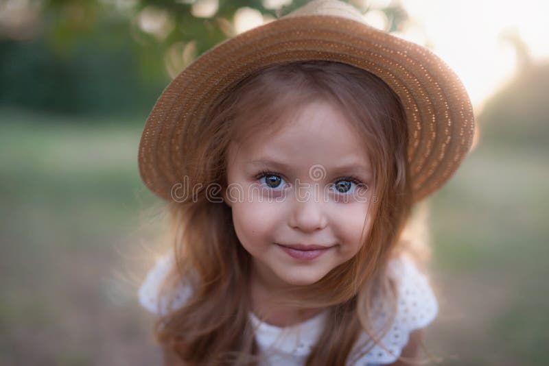 Summer outdoor portrait of beautiful happy child