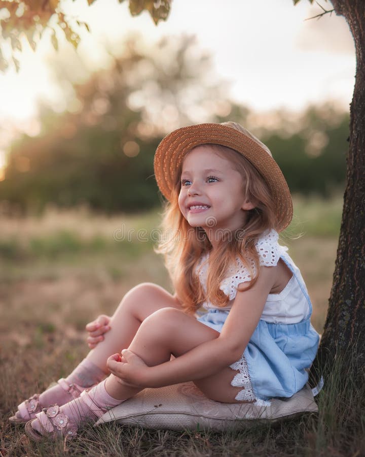 Summer outdoor portrait of beautiful happy child