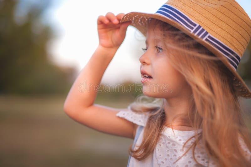 Summer outdoor portrait of beautiful happy child