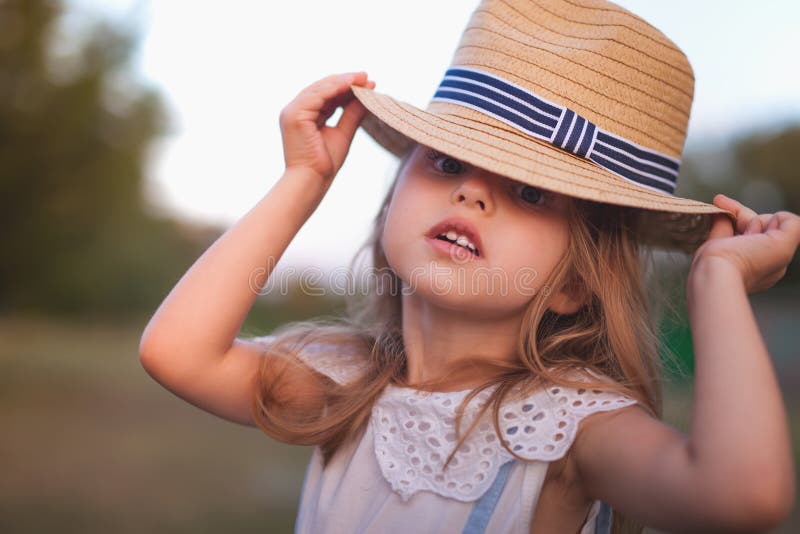 Summer outdoor portrait of beautiful happy child