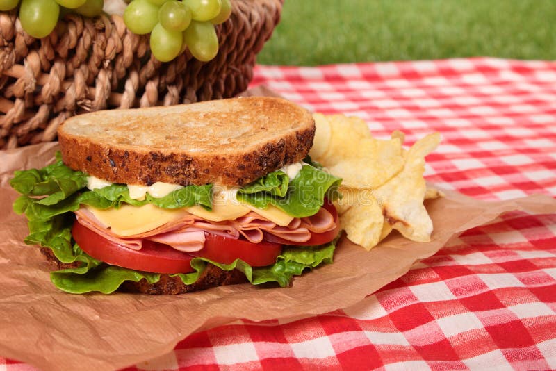Summer Picnic Basket Toasted Ham and Cheese Sandwich Stock Photo