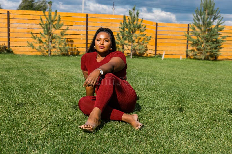 Summer Portrait Of Beautiful African American Woman In Red Casual Wear Standing On Backyard Copy