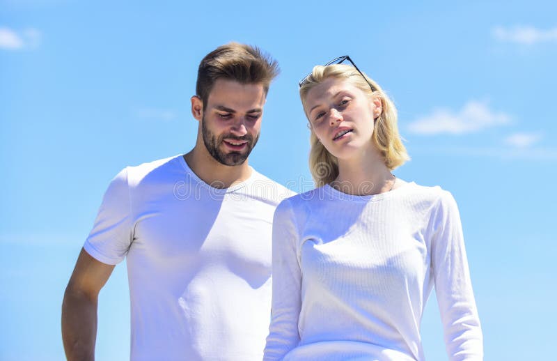 Summer romance. Family love. Devotion and trust. Love story. Romantic relations. Couple in love blue sky background. Man and woman white clothes sunny day outdoors. True love. Communication problems.