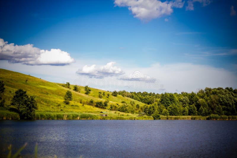 Summer Rural Landscape With The Lake Rolling Hills Trees And B Stock