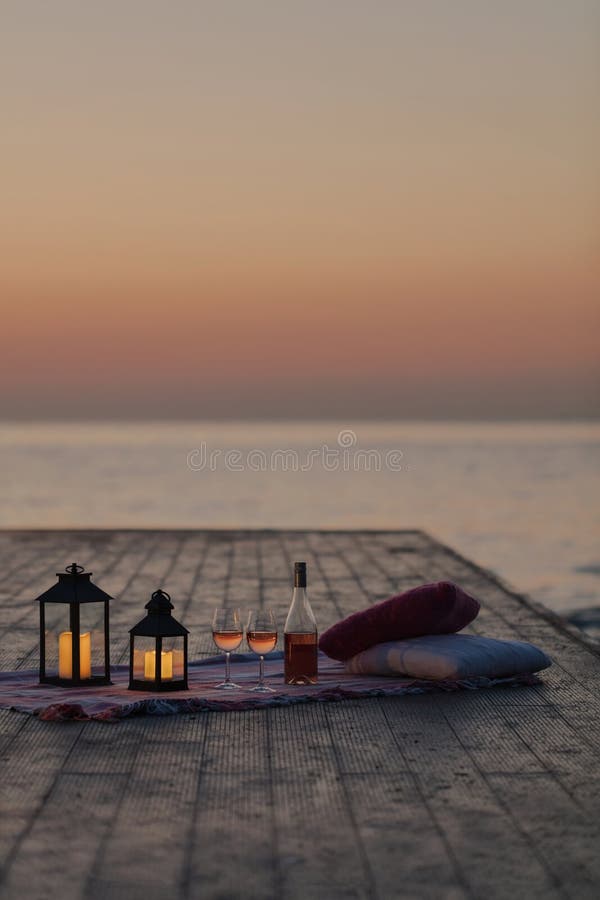 Summer Sea Sunset Romantic Picnic On The Beach Bottle Of Wine Glasses Candles Plaid And