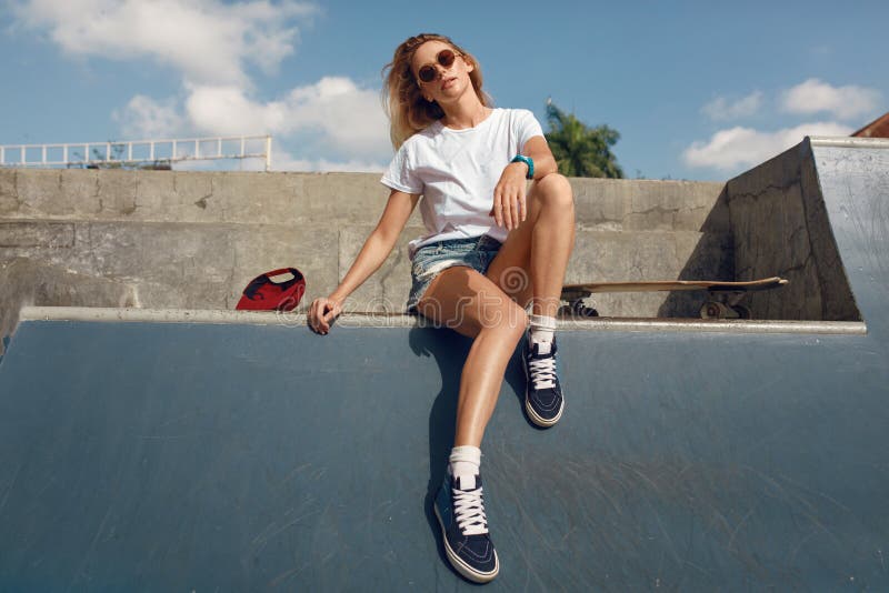 Summer. Skater Girl Sitting on Concrete Skate Ramp at Skatepark. Female  Teenager in Casual Outfit with Skateboard Stock Image - Image of ramp,  extreme: 195691057