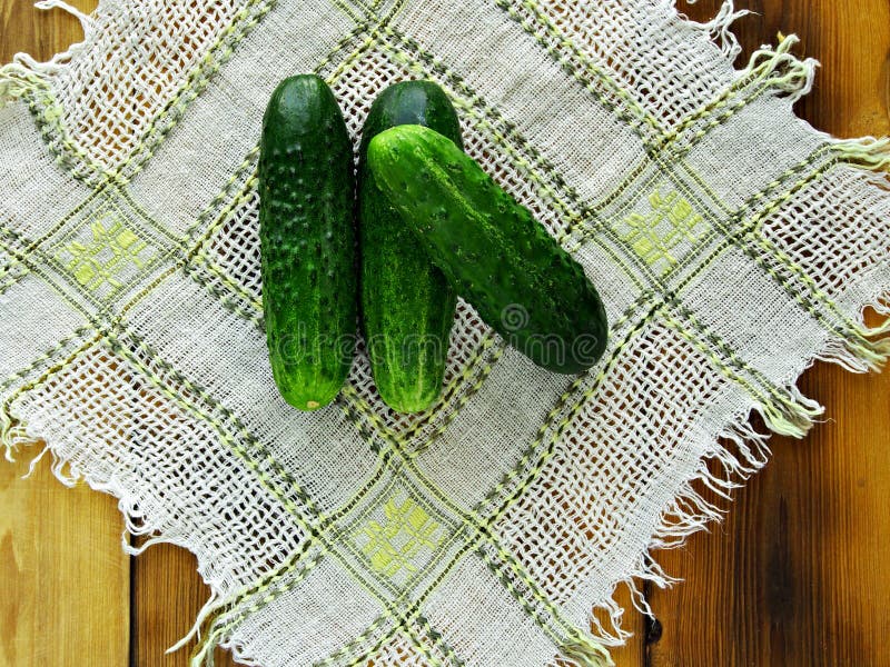 Summer is the time of harvesting vegetables and fruits. Fresh cucumbers are composed of a small slide on a tissue napkin, on a tab royalty free stock photos Summer is the time of harvesting vegetables and fruits. Fresh cucumbers are composed of a small slide on a tissue napkin, on a tab royalty free stock photos