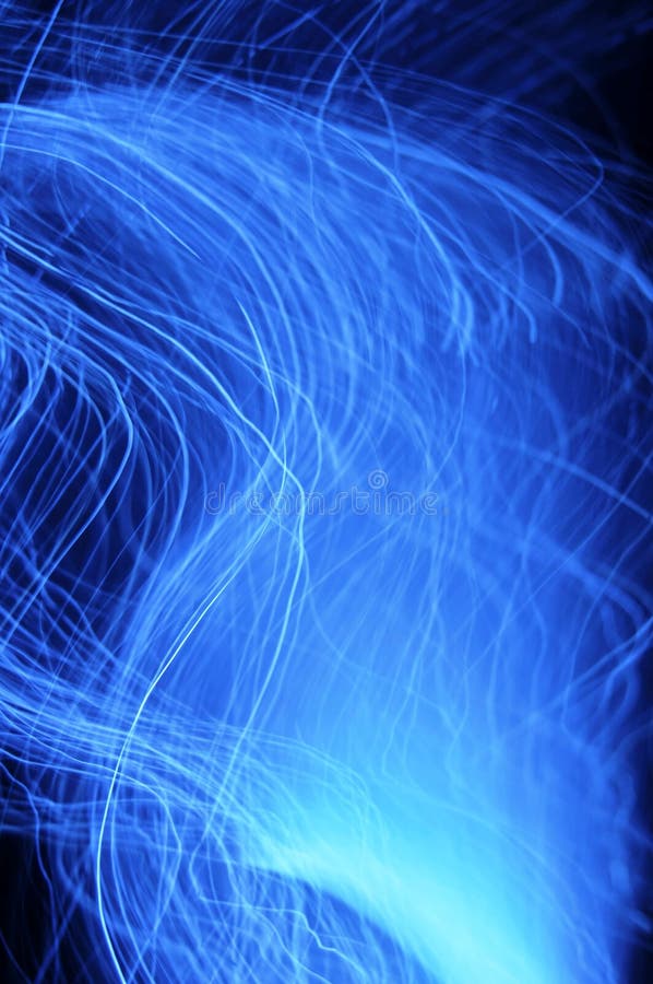 An abstract blue background of long exposures of fibre optic lights. An abstract blue background of long exposures of fibre optic lights