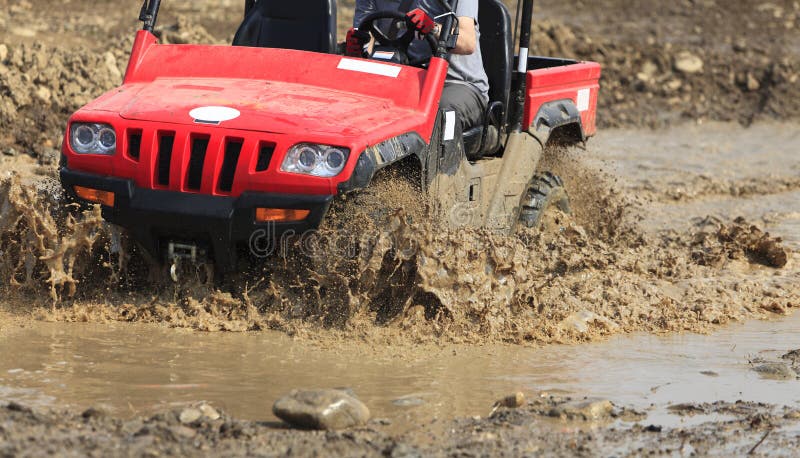 Detail of an ATV during the muddy race. Detail of an ATV during the muddy race.