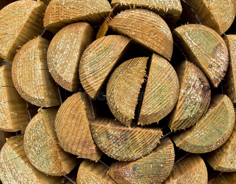 Abstract geometric patterns made by a roll of wooden fencing logs. Abstract geometric patterns made by a roll of wooden fencing logs.